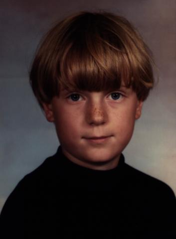 [Head photograph of David Madore at age six]